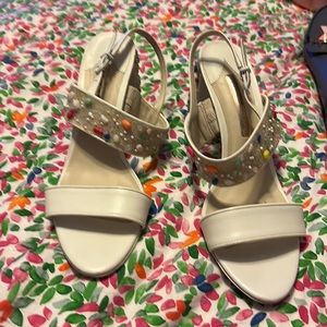 White patent leather heeled sandals with encrusted pebble heel